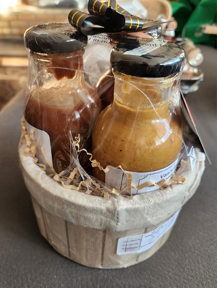 Van’s Grill BBQ sauce duo gift basket with two rustic comfort sauce bottles wrapped in cellophane and ribbon.